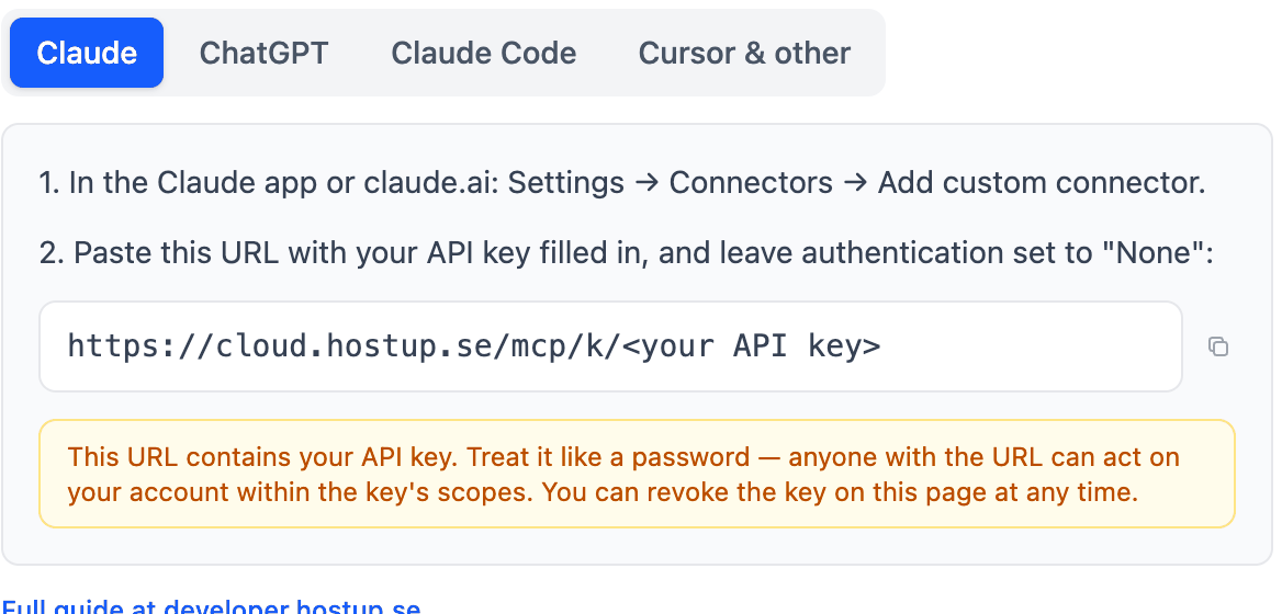 The Claude tab in the AI connectors card. It shows the MCP server address with a placeholder for the API key and a yellow warning that the URL contains the key.